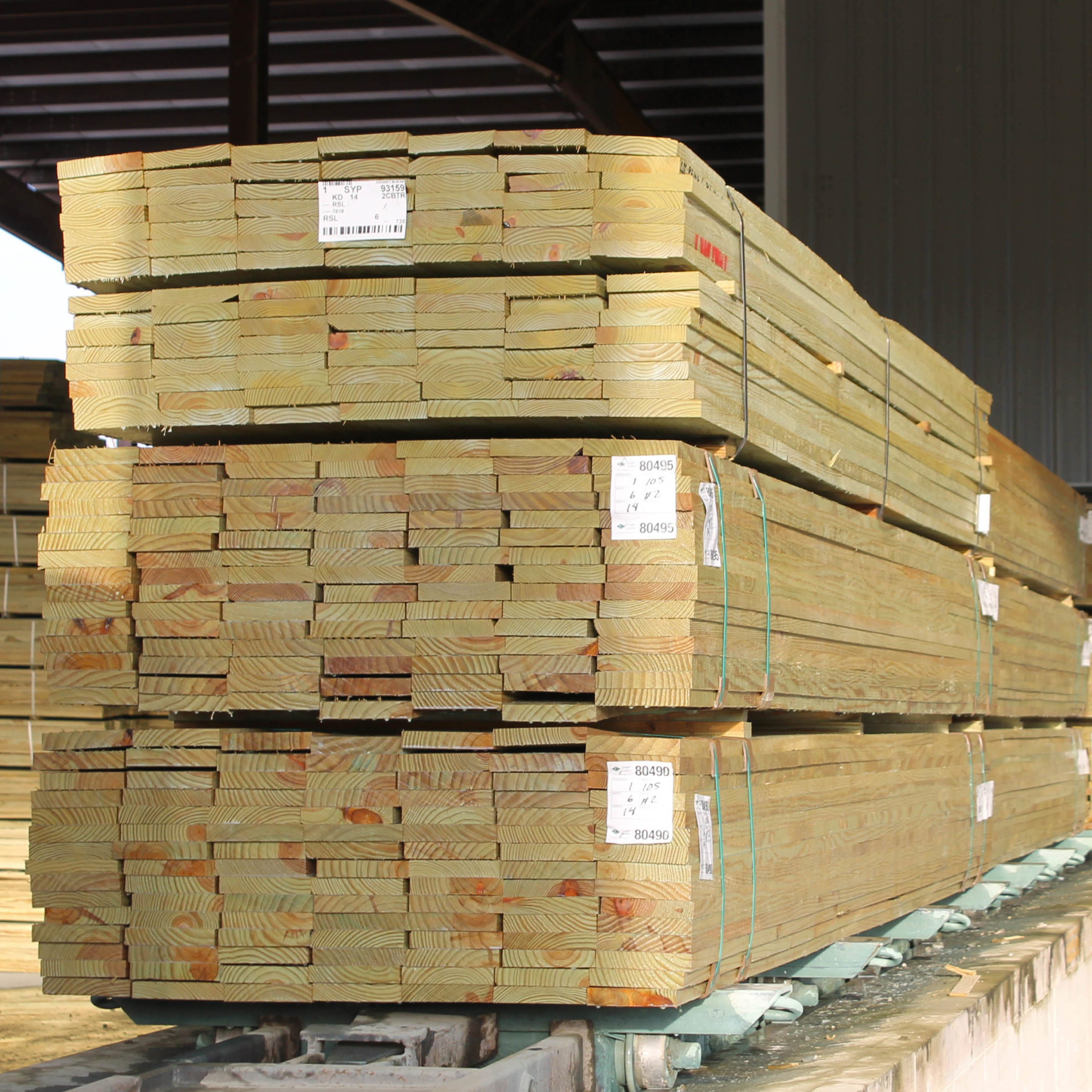 http://Stack%20of%20treated%20lumber